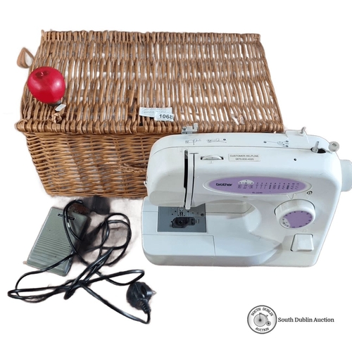 1068 - Brother XL-2230 sewing machine with foot pedal and power cord. Includes woven wicker storage basket.