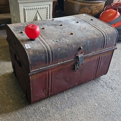 Antique metal trunk with a domed lid, featuring a latch lock and painted blue interior. Approximately 30" wide, 18" high, 18" deep.