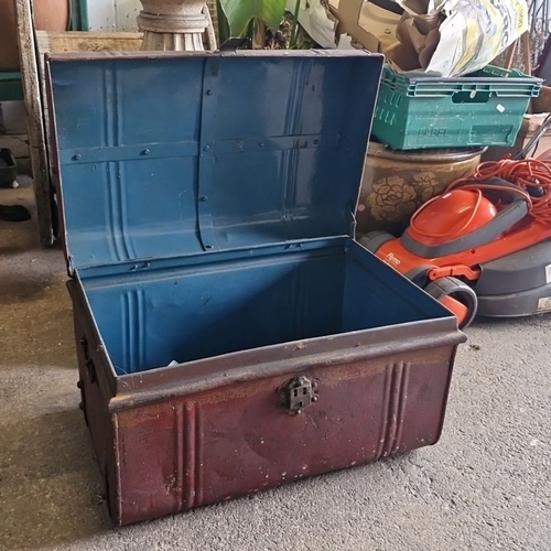 1072 - Antique metal trunk with a domed lid, featuring a latch lock and painted blue interior. Approximatel... 