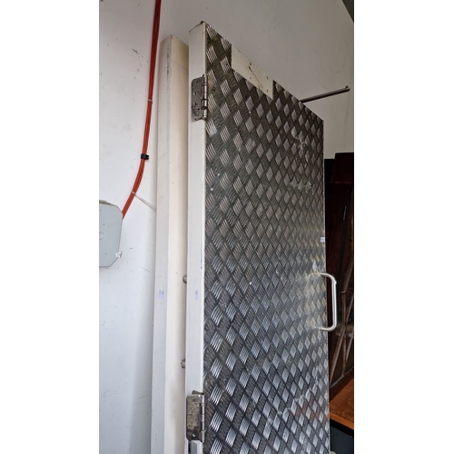 1076 - Star lot : Two Steel checkered security door with sturdy handle and hinges. Approximately 210 cm hig... 