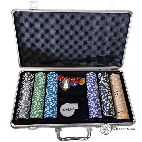 1079 - Poker set in aluminum case includes multicolored poker chips, dice, dealer button, and keys.