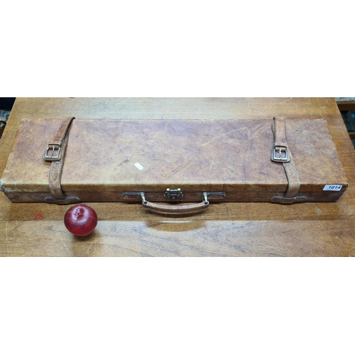 1014 - A gorgeous tan leather gun case fully lined with a beautiful emerald green baize.