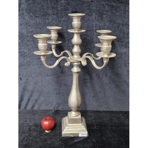 1031 - A very tall articulated five branch candelabra in a silver finish.