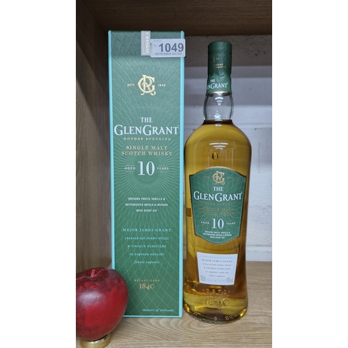 1049 - A 1 litre sealed bottle of the Glen Grant single malt scotch whisky aged 10 years, in its original p... 