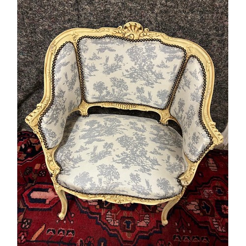 1198 - Star Lot : A very attractive oversized French Salon chair with cream carvced wood frame and white an... 