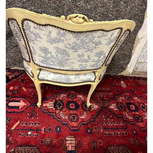 1198 - Star Lot : A very attractive oversized French Salon chair with cream carvced wood frame and white an... 