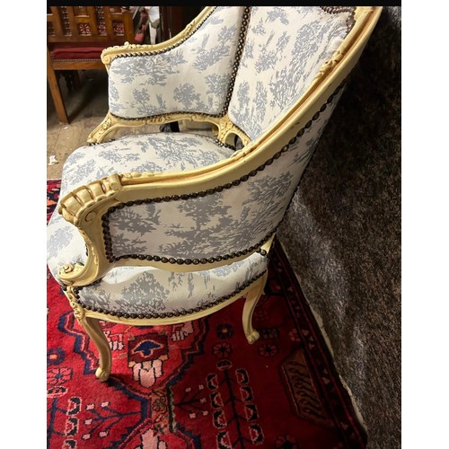 1198 - Star Lot : A very attractive oversized French Salon chair with cream carvced wood frame and white an... 