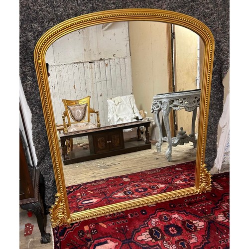 1203 - State Lot : A large impressive over mantle mirror with curved top and carved shoulders With a hand c... 