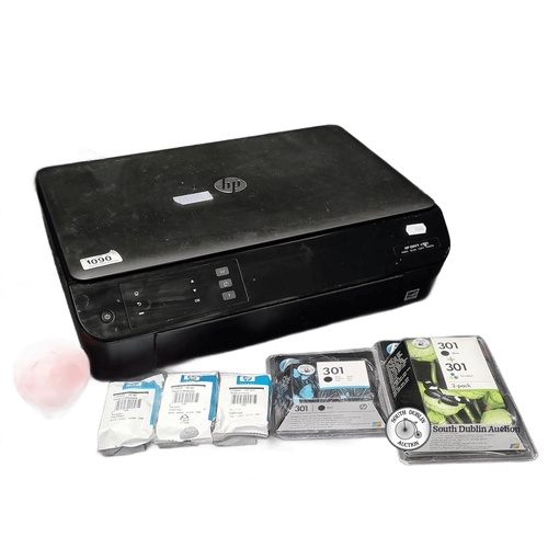 1090 - HP Envy 4500 all-in-one printer with 5 HP 301 ink cartridges included.