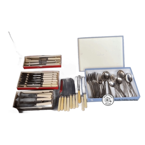 1092 - Newbridge cutlery set, featuring stainless steel knives with cream handles, and a boxed silver-plate... 