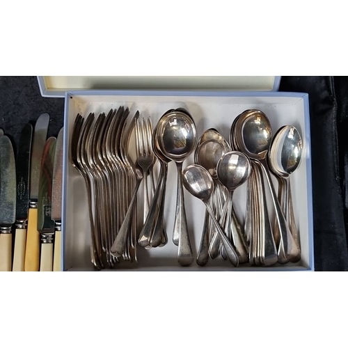 1092 - Newbridge cutlery set, featuring stainless steel knives with cream handles, and a boxed silver-plate... 