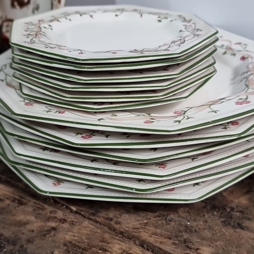 1097 - Johnson Brothers English dinnerware set features floral motifs. Includes plates, bowls, cups, saucer... 