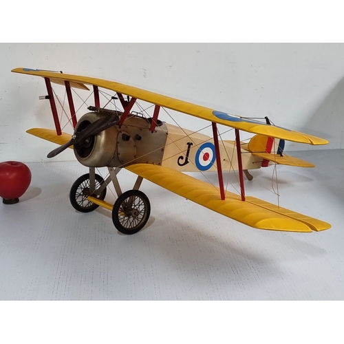 1099 - A large Vintage model biplane with yellow wings, replicating a World War I military aircraft. Featur... 