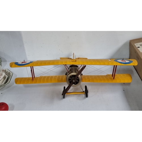 1099 - A large Vintage model biplane with yellow wings, replicating a World War I military aircraft. Featur... 