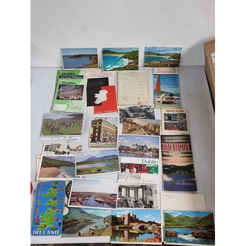 1102 - Collection of vintage Irish postcards and brochures, including Dublin maps and landscapes. Features ... 