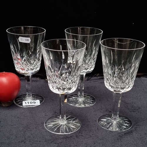 1109 - Set of four Waterford crystal wine glasses, featuring a classic cut pattern. Approximately 7 inches ... 