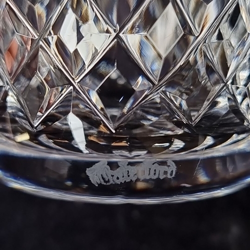 1111 - Set of four Waterford crystal whiskey glasses with intricate diamond-cut pattern, approximately 4 in... 