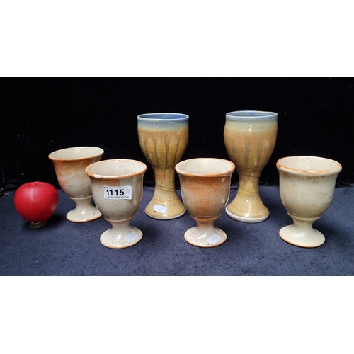 1115 - Set of six art studio pottery goblets featuring a glazed finish with earthy tones.