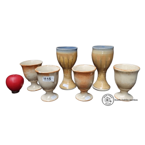 1115 - Set of six art studio pottery goblets featuring a glazed finish with earthy tones.