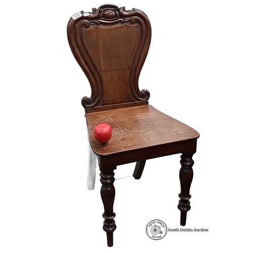 1180 - Victorian mahogany chair featuring carved scroll back and turned legs. Approximately 85cm high, 45cm... 