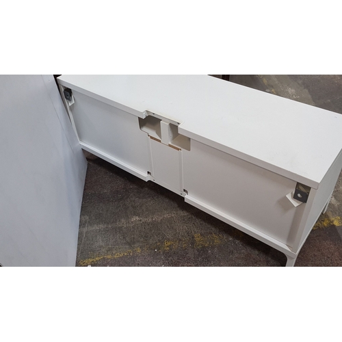 1186 - A low White modern low media unit with two open shelves and two drawers. Approximately 120 cm wide, ... 