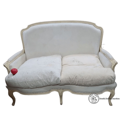 1187 - Antique French-style loveseat, upholstered in cream fabric with carved wooden frame and bergere back... 