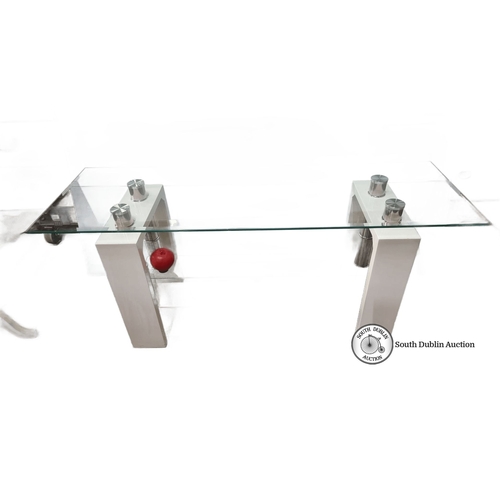 Glass console table with modern chrome accents and white supports