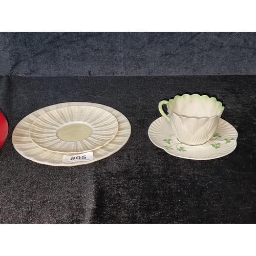 1239 - Four black stamp antique pieces of Belleek including a cup, two saucers and side plate. All in very ... 