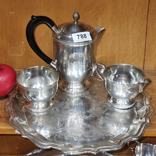 1241 - An Antique silver plate four piece tea service including coffee pot, creamer, sugar bowl and a round... 