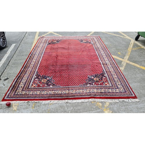 1257 - Super Star Lot: A fabulous, very large, quality hand knotted rug in a geometric pattern predominantl... 