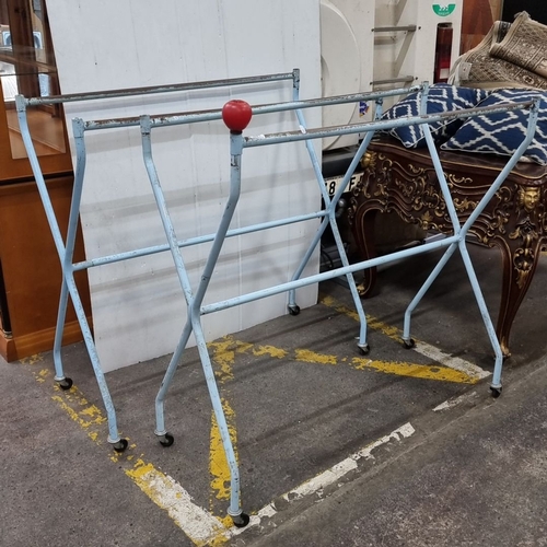 1271 - Two vintage metal garment rack with wheels and a red knob, approximately 130cm high, 160cm wide, and... 