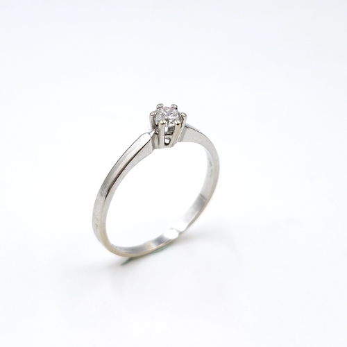 1275 - Star Lot : A nine carat white gold Solitaire diamond ring. Est. weight of diamond is 0.20 carats. Ha... 