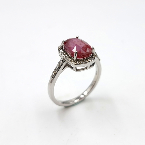 1279 - Star lot : A pretty cabochon ruby gemstone ring set with diamond surround mounted in sterling silver... 