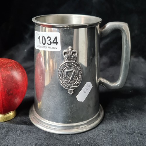 1034 - An English Sheffield rose pewter tankard featuring the crest of the Royal Ulster Constabulary with l... 