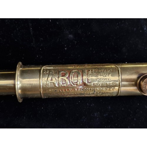 115 - An antique brass ABOL no. 5 Patent  garden rose syringe sprayer. Lovely turned wood handle.