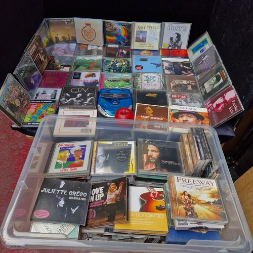 318 - A huge crate of CD's Approx 150, some great titles. Also a personal Cd player.