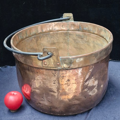 382 - Star Lot : A very large French antique copper and brass  cauldron with wrought iron swing handle. St... 