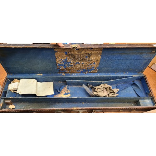 1011 - A fine example of an antique leather gun case with sold brass hardware and leather handle.