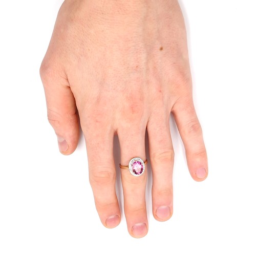 1 - Star Lot : A beautiful nine carat gold large pink spinal gemstone ring set with diamond surround. Si... 