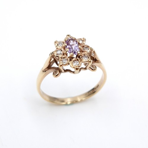 3 - Star Lot : A very elegant nine carat gold diamond and amethyst stone ring with star design. Ring siz... 