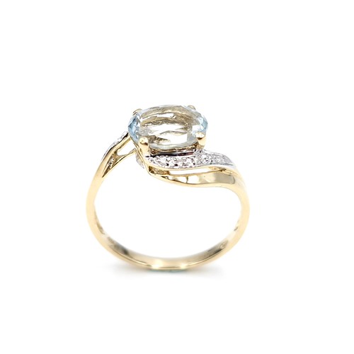 8 - Star Lot : A beautiful example of a large aquamarine gemstone ring set in nine carat gold with diamo... 