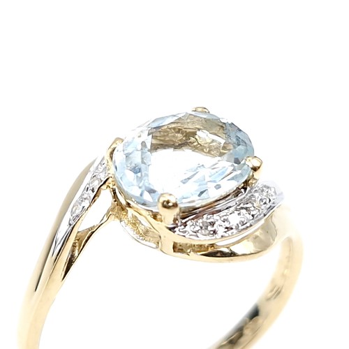 8 - Star Lot : A beautiful example of a large aquamarine gemstone ring set in nine carat gold with diamo... 