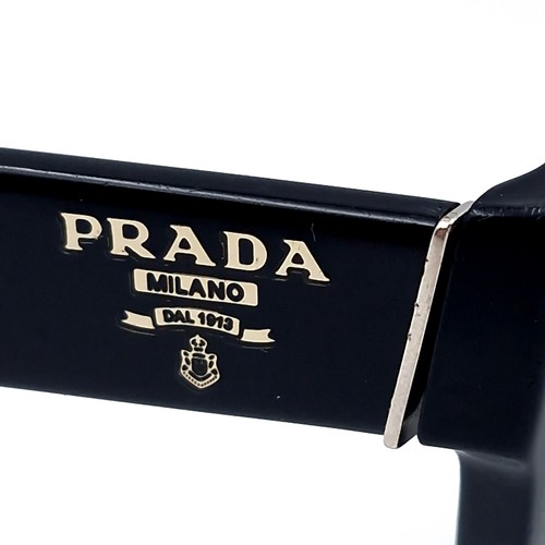 14 - A pair of Prada Milano DAL 1913 sunglasses set with black frames. Comes in original Prada box.