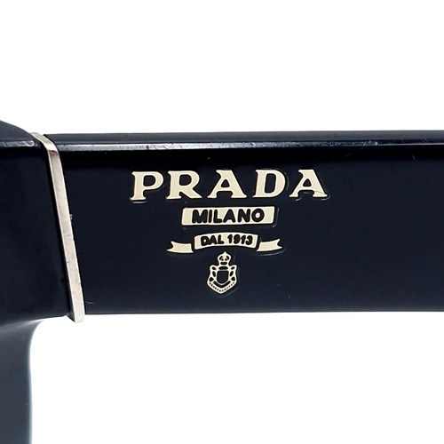 14 - A pair of Prada Milano DAL 1913 sunglasses set with black frames. Comes in original Prada box.