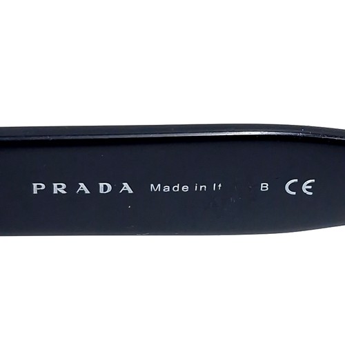 14 - A pair of Prada Milano DAL 1913 sunglasses set with black frames. Comes in original Prada box.