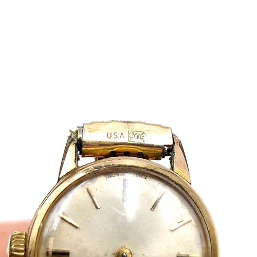 413 - Star Lot : A vintage Omega ladies wristwatch with gold toned case set with patterned hands and exten... 