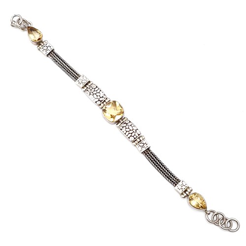 414 - A beautiful example of an antique sterling silver bracelet with three mounted citrine gemstones with... 