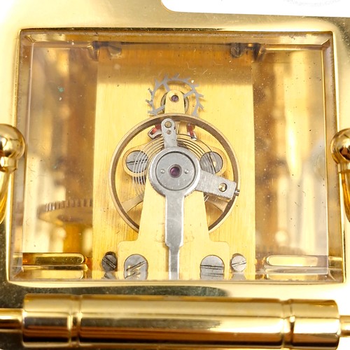 421 - A lovely example of a brass carriage clock by Jens Olsen with inspection aperture set with white ena... 