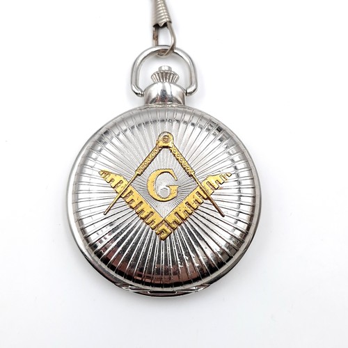 440 - A masonic quartz pocket watch with masonic dial and sweep second hand with chain. Dimensions: 5 cms ... 