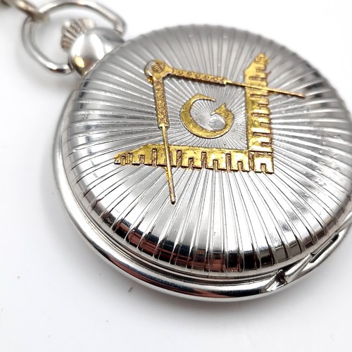 440 - A masonic quartz pocket watch with masonic dial and sweep second hand with chain. Dimensions: 5 cms ... 